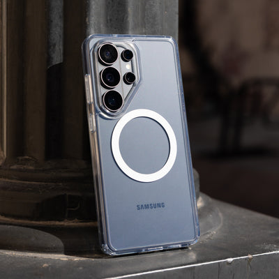 Samsung phone case with clear back and magnet ring on a dark surface