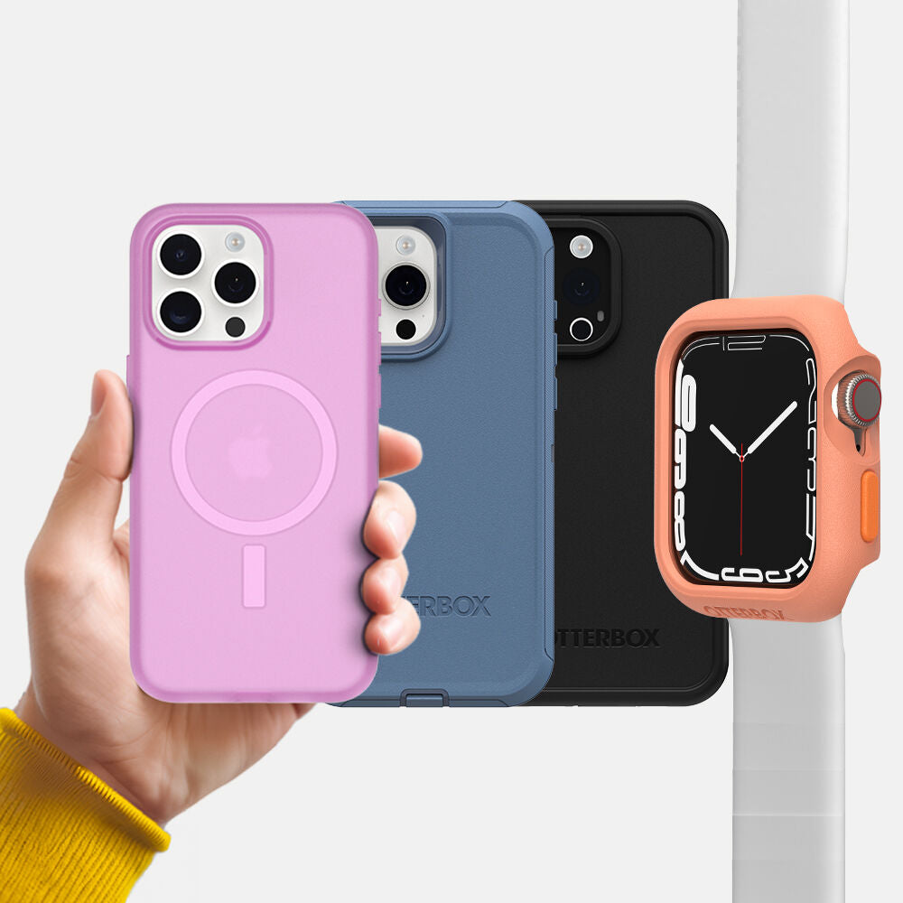 Hand holding a pink phone case with three other phone cases and an orange watch case in the background.